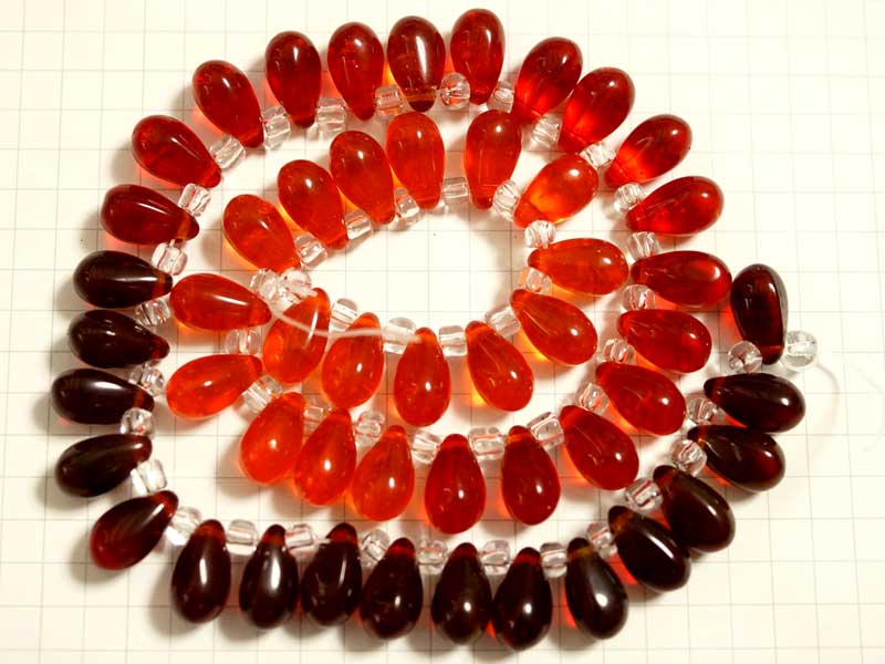 BG168FM グラスビーズ　１２×７　ファイアオパール・シャムＭＩＸ　１連